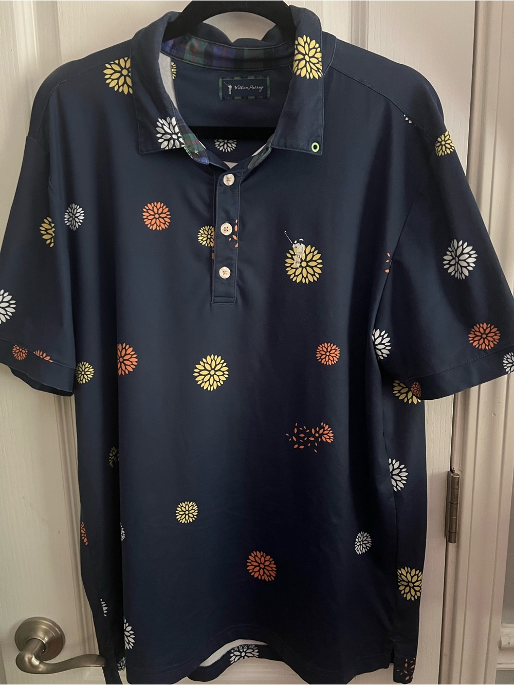 William Murray Golf Navy Polo with Yellow, Orange & White Floral Motif